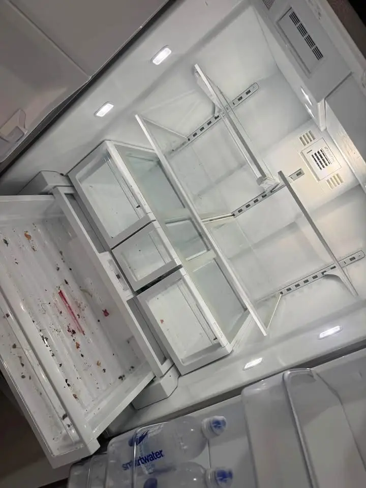 Refrigerator crisper drawer with food debris, before cleaning